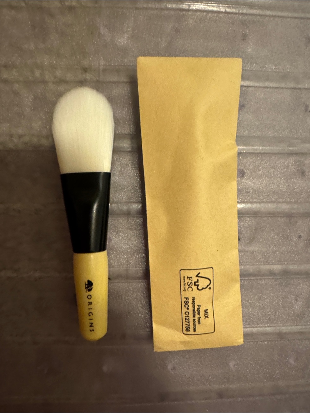 An individual face mask Brush with White Bristles and Natural Handle - brand new